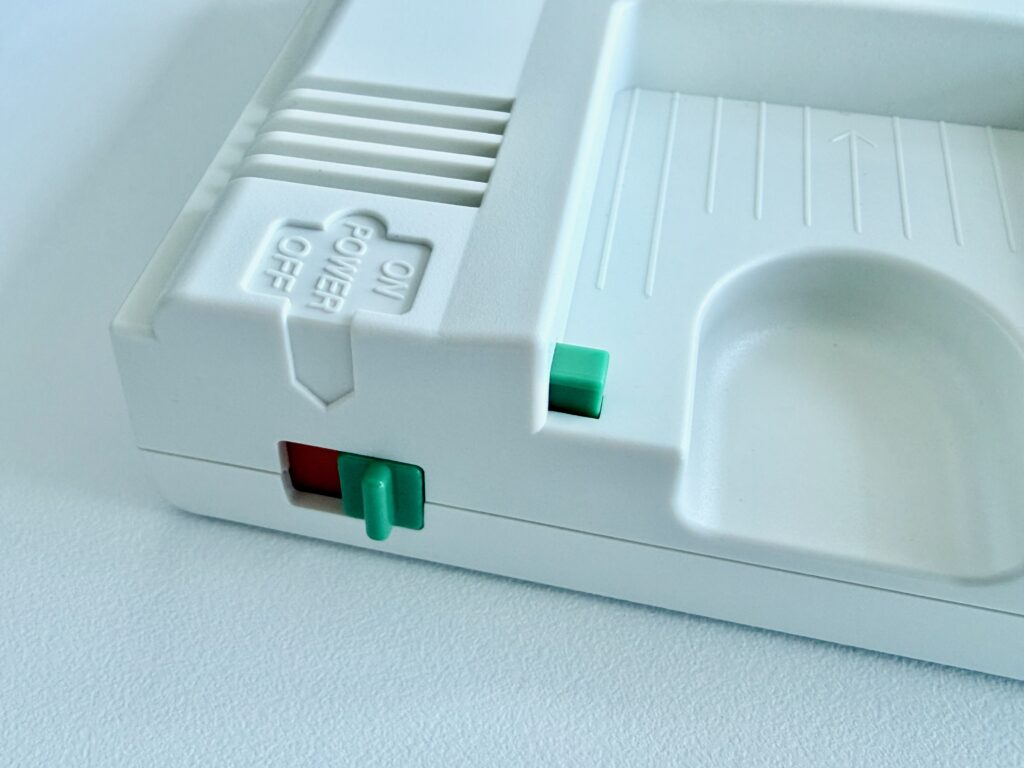 The power switch turned "on" revealing  the green tab